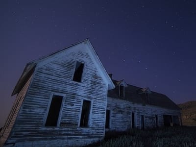Abandoned House with Starry Sky